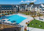 Thumbnail 1 of 49 - an aerial view of an apartment complex with a swimming pool