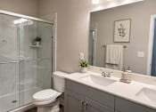 Thumbnail 17 of 71 - Bathroom with walk in shower and vanity lighting