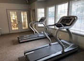 Thumbnail 19 of 21 - Fitness center treadmills at Lake in the Woods, Florida