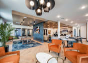 Thumbnail 7 of 47 - a lobby with couches chairs and tables and a bar