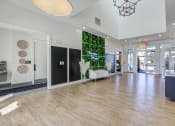 Thumbnail 6 of 22 - a living wall in the center of a room with a wooden floor