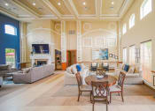 Thumbnail 6 of 69 - a large living room with couches and chairs and a table