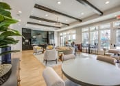 Thumbnail 2 of 22 - a large living room with couches and chairs and a table