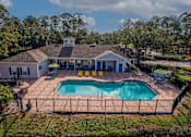 Thumbnail 2 of 49 - A house with a pool in the backyard.