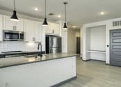 Thumbnail 28 of 47 - Open kitchen and spacious living room in Apollo Beach, Florida