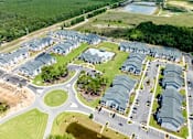Thumbnail 48 of 48 - A large, roundabout is in the middle of a housing development.