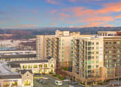 Thumbnail 46 of 47 - an aerial view of a large building on a city street