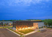 Thumbnail 28 of 28 - an aerial view of a building at night with lights