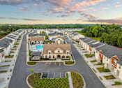 Thumbnail 69 of 71 - an aerial view of a neighborhood with houses and a pool