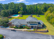 Thumbnail 26 of 35 - a large house with a yard and a swimming pool