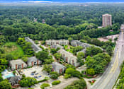 Thumbnail 36 of 38 - A bird's eye view of a residential area with a road running through it.