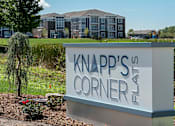 Thumbnail 26 of 30 - Knapp's Corner sign in front of a building.