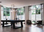 Thumbnail 23 of 31 - a conference room with a table and chairs and large windows