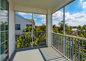 Thumbnail 22 of 36 - the view from the balcony of a home with large windows