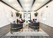 Thumbnail 2 of 45 - A living room with two grey sofas and a patterned rug.