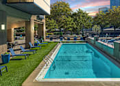 Thumbnail 1 of 32 - A rectangular pool with a metal railing and a concrete floor.