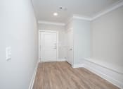 Thumbnail 39 of 54 - a renovated living room with white walls and wood floors