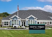 Thumbnail 35 of 35 - A building with the number 5549 and the name (echo ridge) apartment on a sign in front of it.