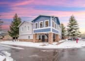 Thumbnail 38 of 43 - a blue house with a red fire hydrant in the snow
