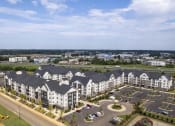 Thumbnail 56 of 56 - an aerial view of an apartment complex with a parking lot