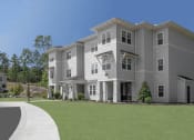 Thumbnail 22 of 54 - a large apartment building with a lawn in front of it