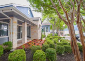 Thumbnail 28 of 31 - the front yard of a house with a garden and trees