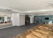 Thumbnail 20 of 21 - Studios, One, Two, and Three-BR Apartments in Chattanooga, TN - Populus Waterside - State-of-the-art Fitness Center with Weights, Cardio Equipment, Large Mirror, Ceiling Fans, Large Windows, and TV