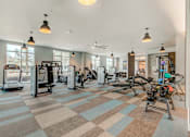 Thumbnail 10 of 30 - A gym with a variety of exercise equipment.
