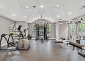 Thumbnail 19 of 29 - A spacious home gym with a variety of exercise equipment.