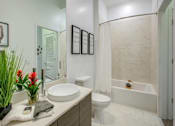 Thumbnail 14 of 34 - a bathroom with a sink toilet and bathtub at Altis Grand Central, Florida, 33606