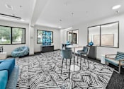 Thumbnail 3 of 34 - A modern living room with a black and white patterned carpet.