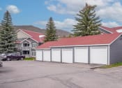 Thumbnail 8 of 20 - a row of garages in front of some houses