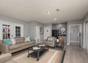 Thumbnail 8 of 23 - A living room with a couch, coffee table, and a rug.