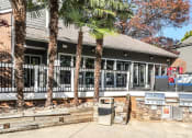 Thumbnail 22 of 31 - the front of a building with palm trees in front of it