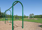 Thumbnail 58 of 58 - a playground at a park with a swing set