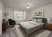 Thumbnail 18 of 33 - A bedroom with a large bed, a chair, and a ceiling fan.