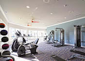Thumbnail 20 of 29 - a gym with a lot of exercise equipment in it