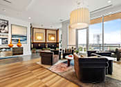 Thumbnail 65 of 72 - A living room with a large window and a view of the city.