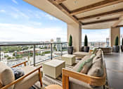 Thumbnail 69 of 72 - A modern living room with a view of the cityscape.
