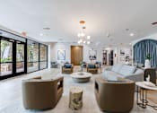 Thumbnail 3 of 28 - A living room with a white ceiling and a large window.