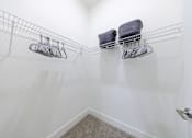 Thumbnail 21 of 28 - Two shoe racks with shoes on them.