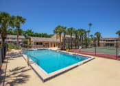Thumbnail 3 of 38 - our resort style swimming pool is next to our tennis court and our building with palm