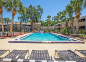Thumbnail 2 of 38 - our resort style swimming pool is next to our apartment buildings and palm trees