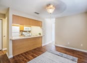 Thumbnail 21 of 38 - an empty apartment with a kitchen and a living room