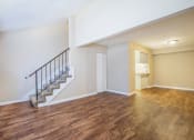 Thumbnail 28 of 38 - the living room and dining room of a renovated house with wood flooring