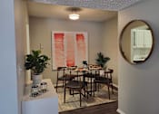 Thumbnail 18 of 31 - A dining room with a table set for four  at Waterview at Rocky Point, Florida