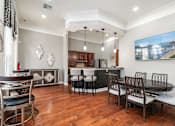 Thumbnail 10 of 30 - a dining room and kitchen with a table and chairs