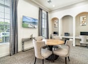 Thumbnail 9 of 30 - a dining room with a table and chairs
