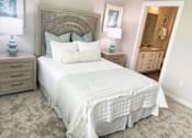 Thumbnail 16 of 50 - a bedroom with a large bed and two night stands