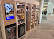 Thumbnail 20 of 41 - A vending machine with a screen advertising overnight guest rentals.